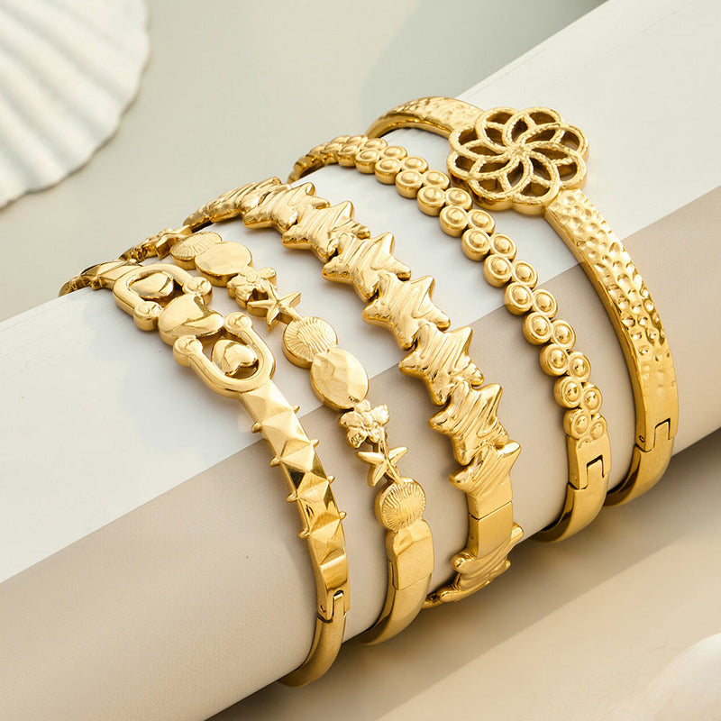 Astra gold bangle with circle, star and oval details, 316L stainless steel — Crown Crest Jewel