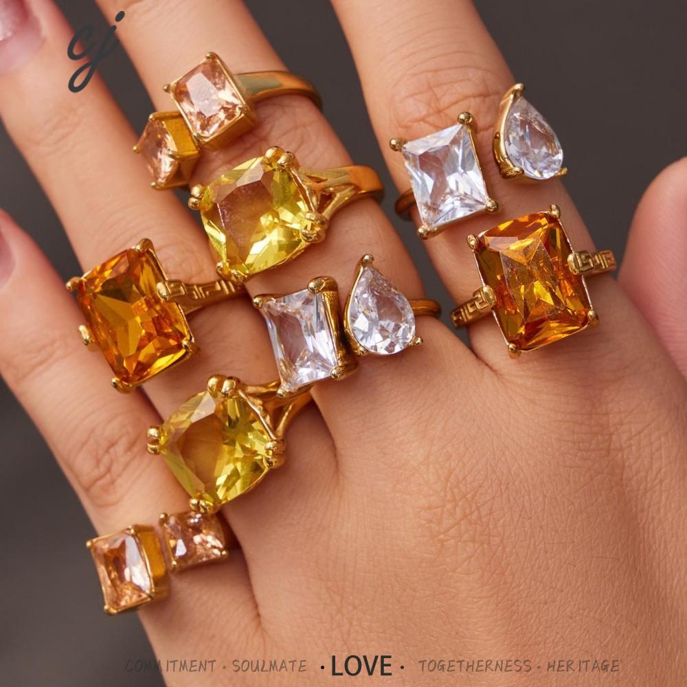 Solenne gold ring with a vibrant orange rectangular stone, 316L stainless steel — Crown Crest Jewel