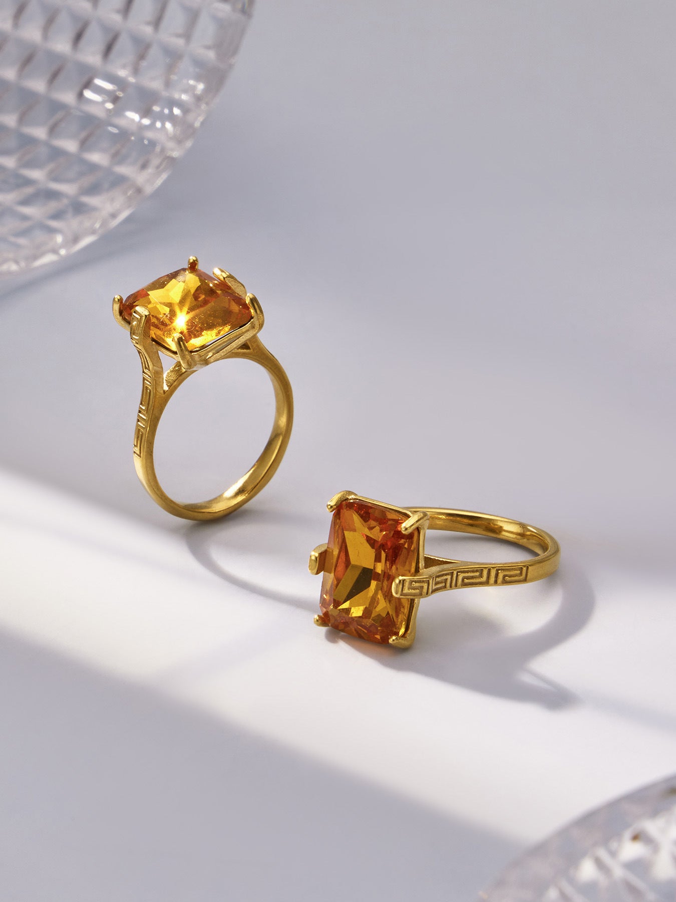 Solenne gold ring with a vibrant orange rectangular stone, 316L stainless steel — Crown Crest Jewel