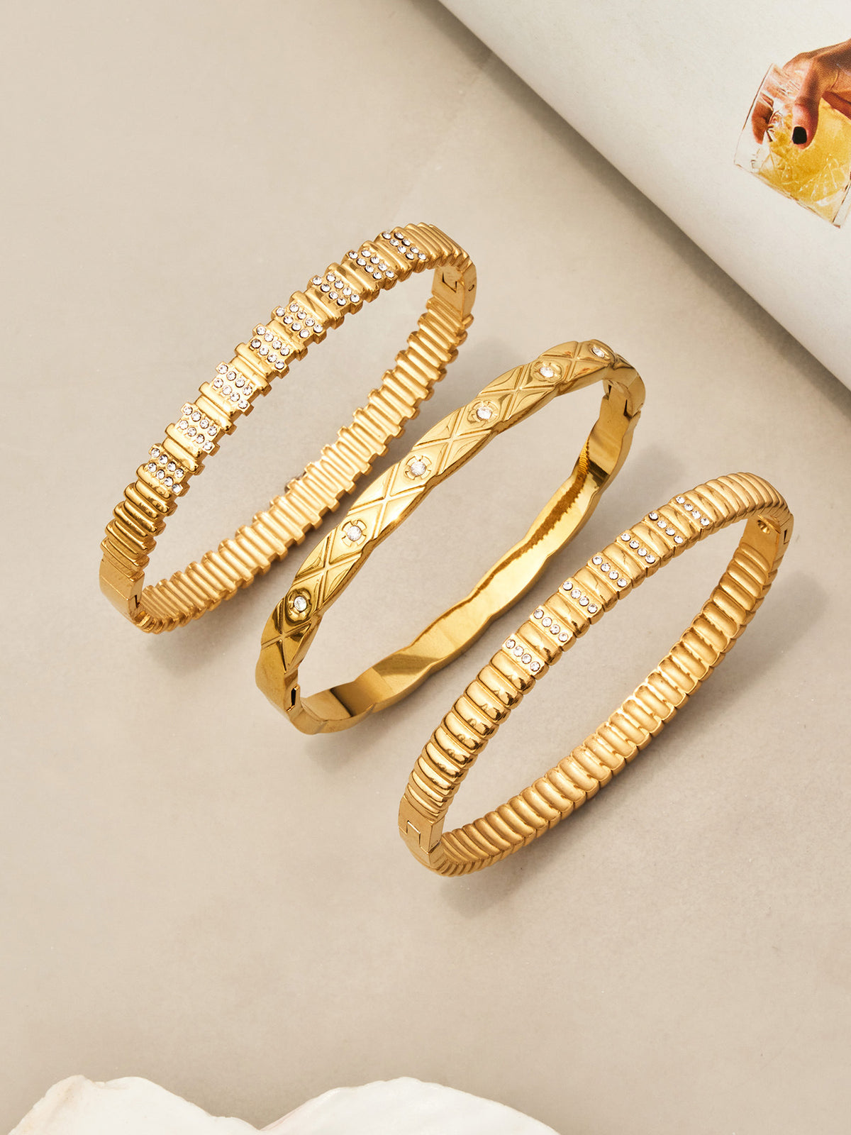 Lucienne sleek gold bangle with sparkling stone detail, 316L stainless steel — Crown Crest Jewel