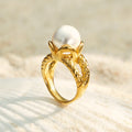 Orlisse bold gold ring with a luminous raised pearl, 316L stainless steel — Crown Crest Jewel