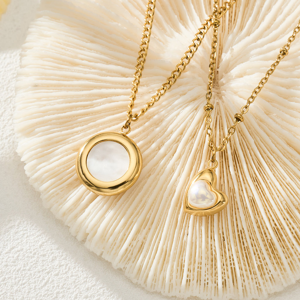 Nia gold necklace with a circular pendant framing a white stone, 316L stainless steel — Crown Crest Jewel