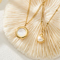 Nia gold necklace with a circular pendant framing a white stone, 316L stainless steel — Crown Crest Jewel