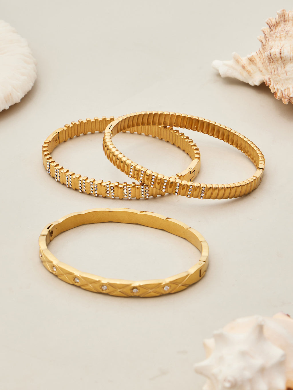 Lucienne sleek gold bangle with sparkling stone detail, 316L stainless steel — Crown Crest Jewel