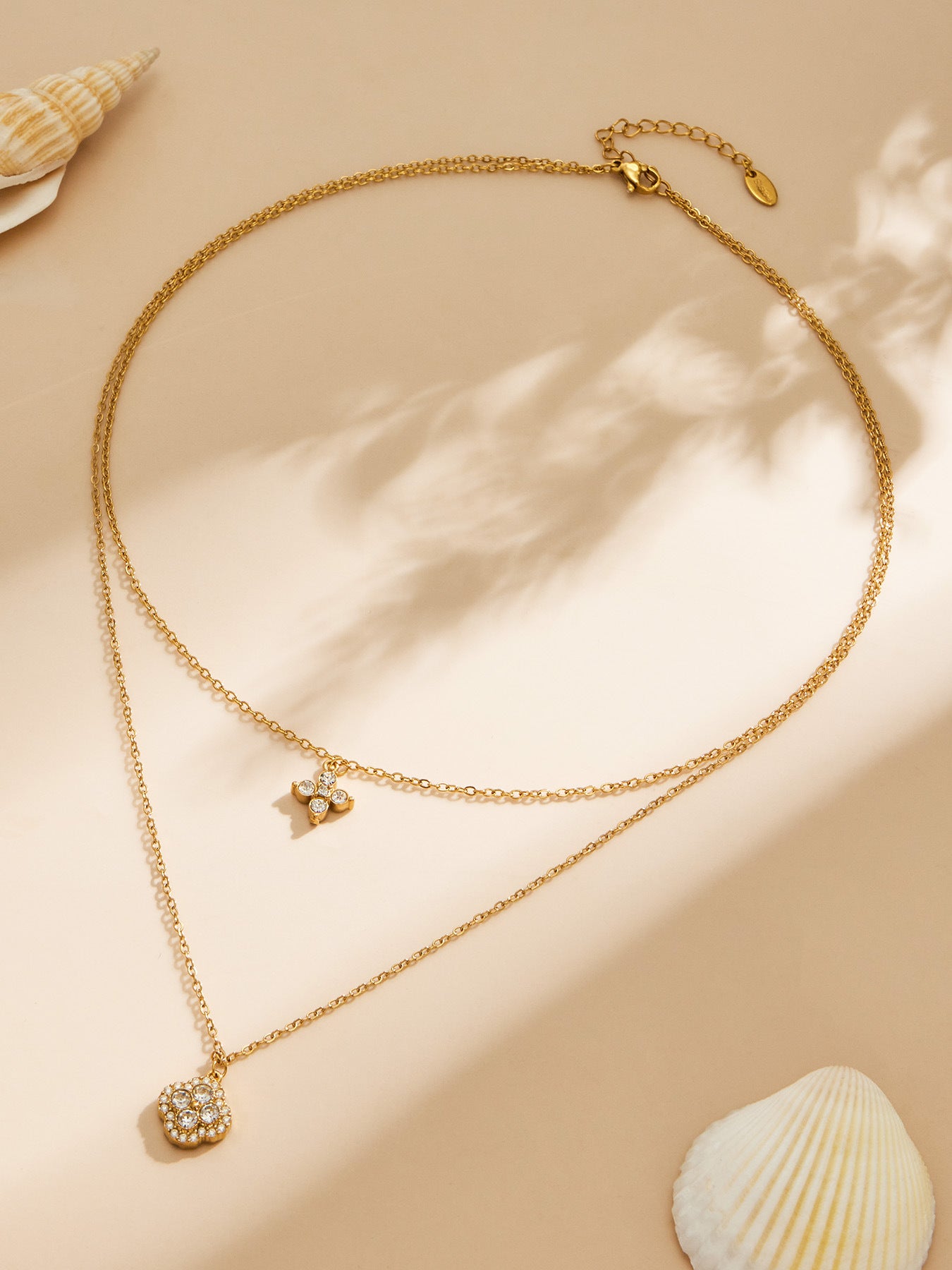 Zaria layered gold necklace with star and floral charm, 316L stainless steel — Crown Crest Jewel