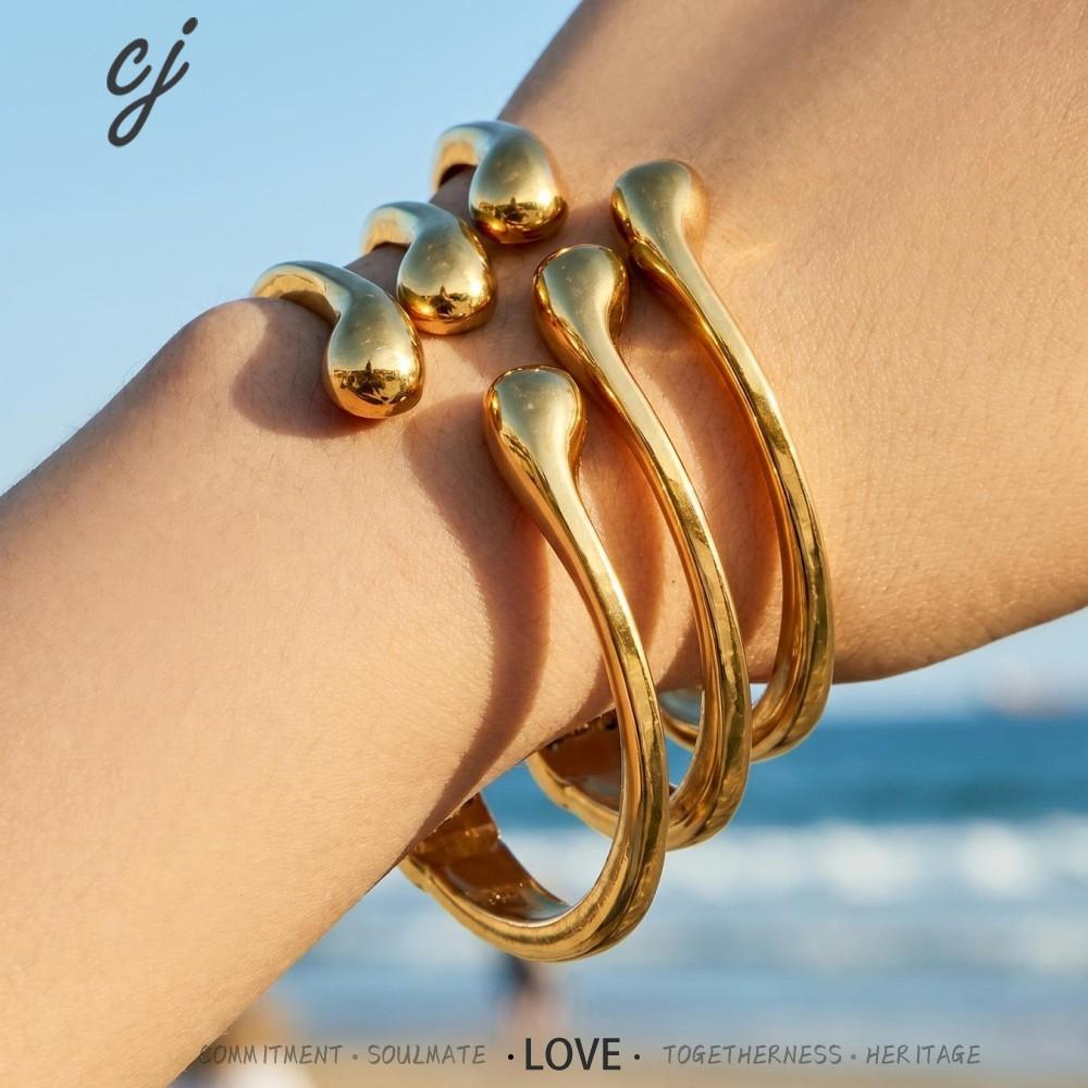 Dhahabu gold-tone hinged bangle in 316L stainless steel — Crown Crest Jewel
