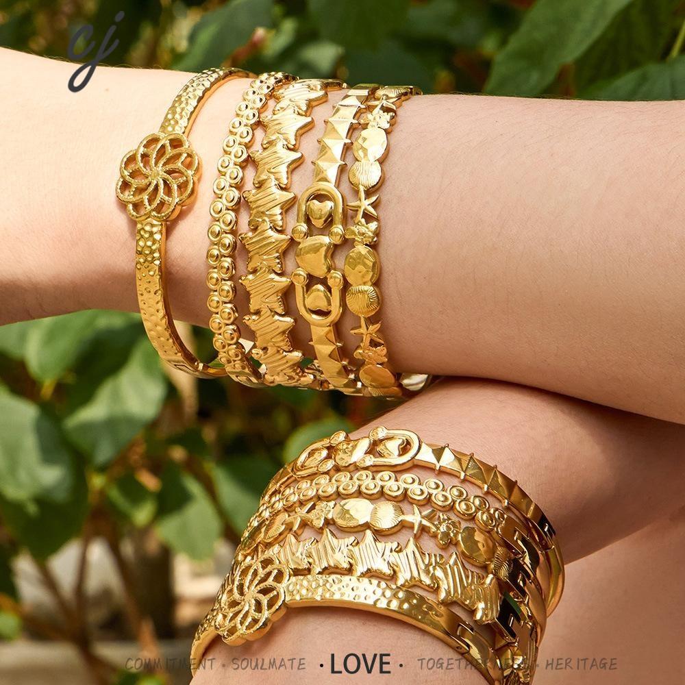Fleura gold bangle with floral centrepiece, 316L stainless steel — Crown Crest Jewel