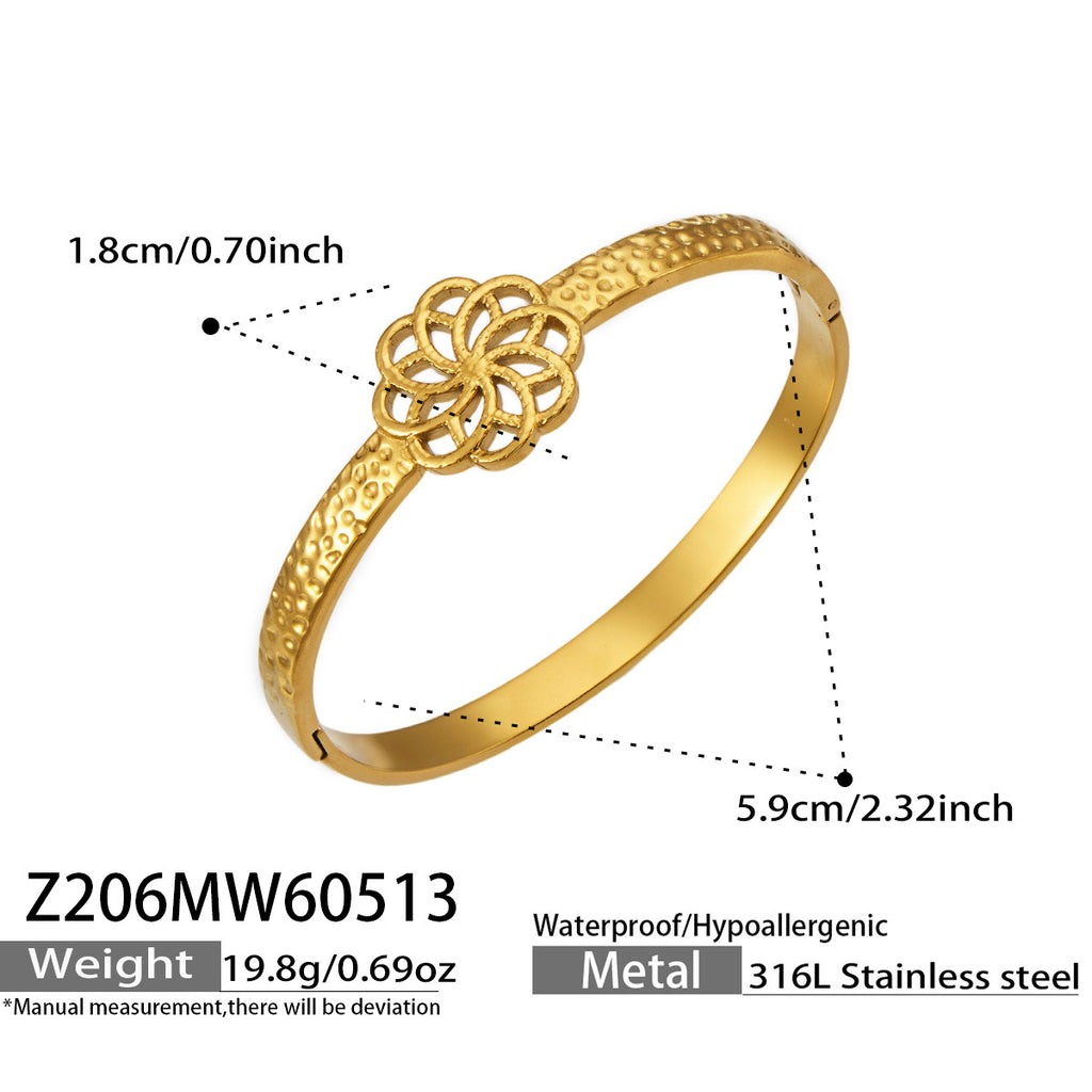 Fleura gold bangle with floral centrepiece, 316L stainless steel — Crown Crest Jewel