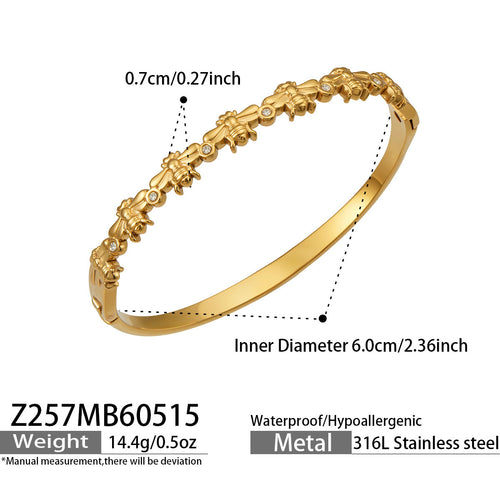 Aste slender gold bangle with sculptural stone detail, 316L stainless steel — Crown Crest Jewel