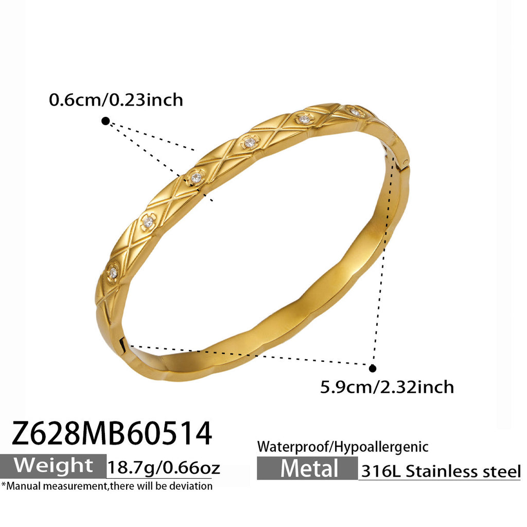 Elara gold bangle with X-motifs and tiny stones, 316L stainless steel — Crown Crest Jewel