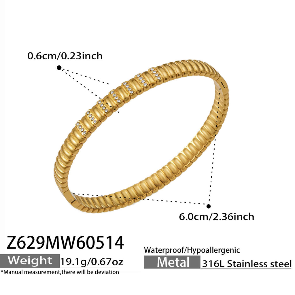 Lucienne sleek gold bangle with sparkling stone detail, 316L stainless steel — Crown Crest Jewel